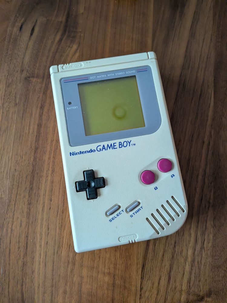 An original Nintendo Game Boy handheld electronic gaming device
