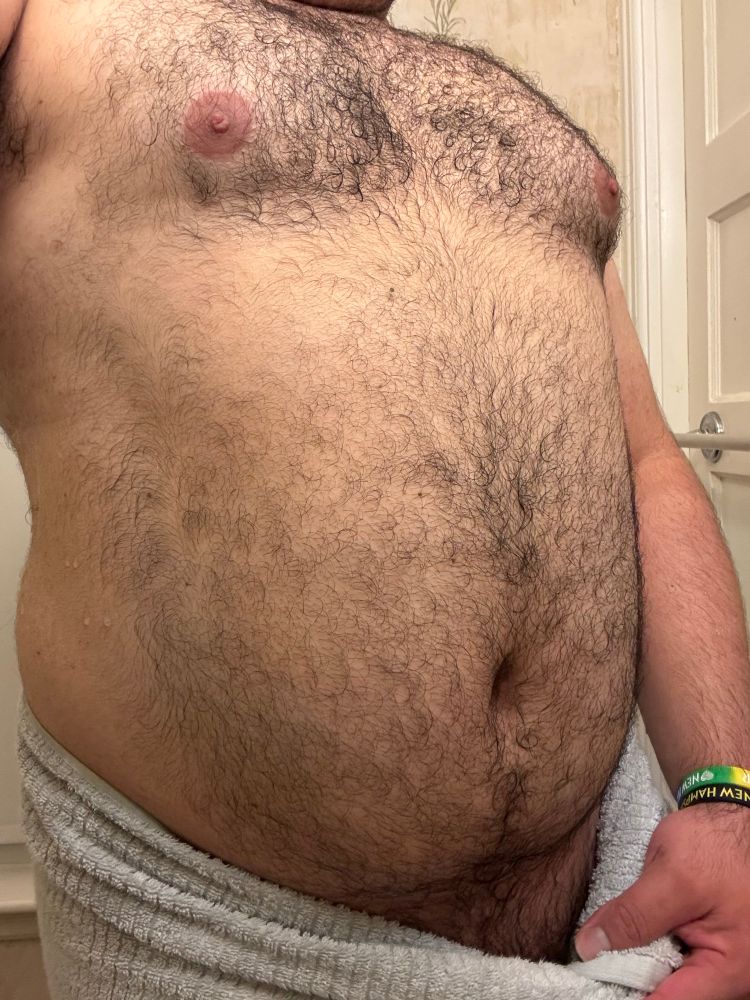 me shirtless with a towel wrapped around my waist showing a very small amount of bush