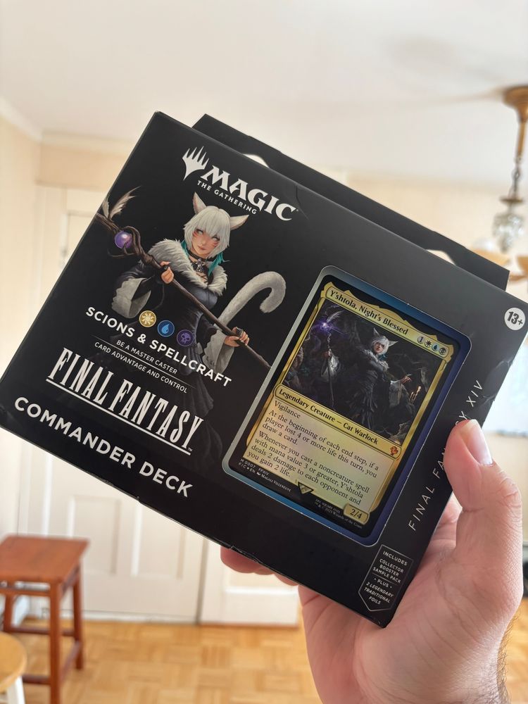 me holding up the Magic the Gathering Final Fantasy Commander Deck for Y'shtola.