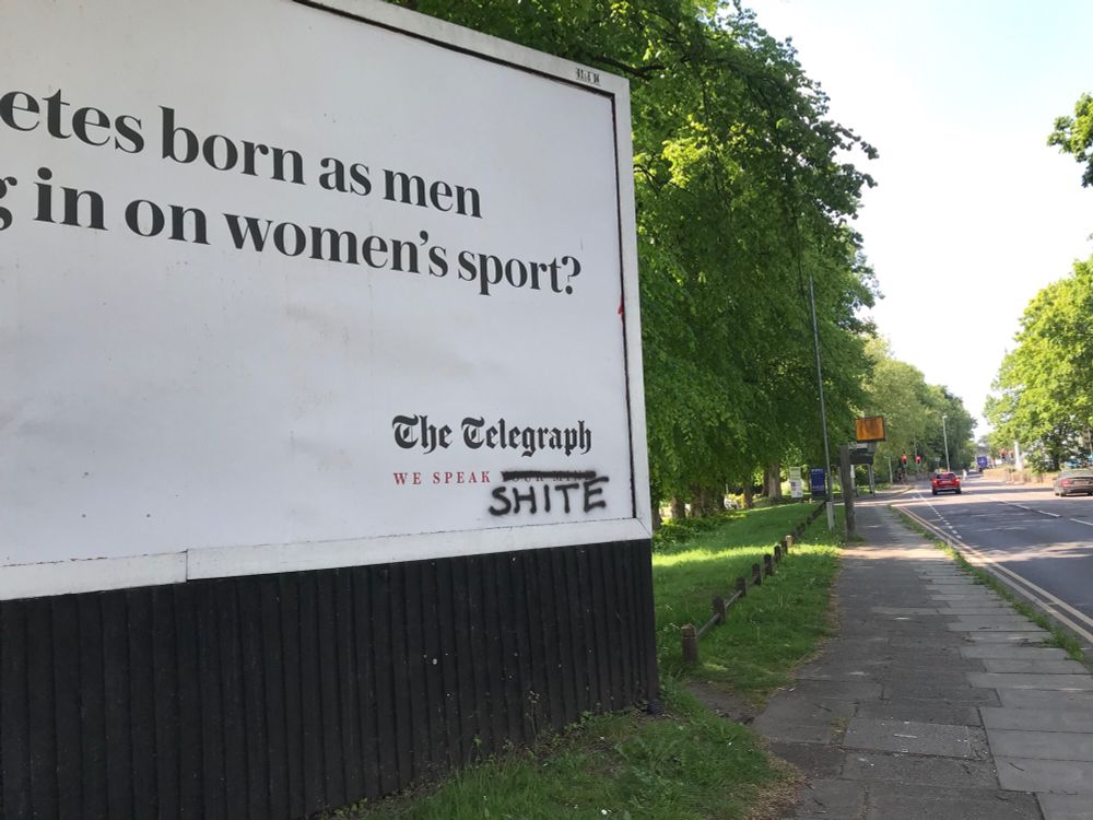 An advertising Billboard for The Daily Telegraph, with the We Speak Your Thoughts tagline sprayed over to read “We Speak Shite”