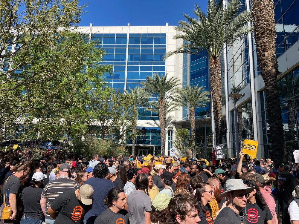 taken from the back of the crowd, hundreds of Animation Guild members are gathered outside Netflix’s Burbank studio building in our “March on the Boss”