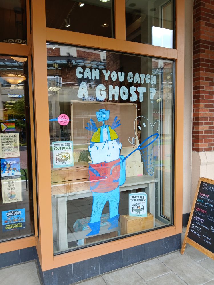 A finished outside view of Rachel Michelle Wilson's To Catch a Ghost window display at Brick & Mortar Books. 