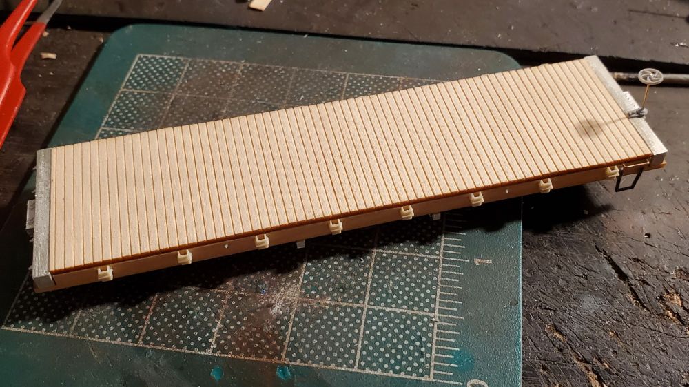 Bitter Creek flatcar with 8 stake pockets per side. 