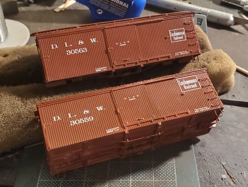 Two DL&W 28' boxcars built from F&C kits.
