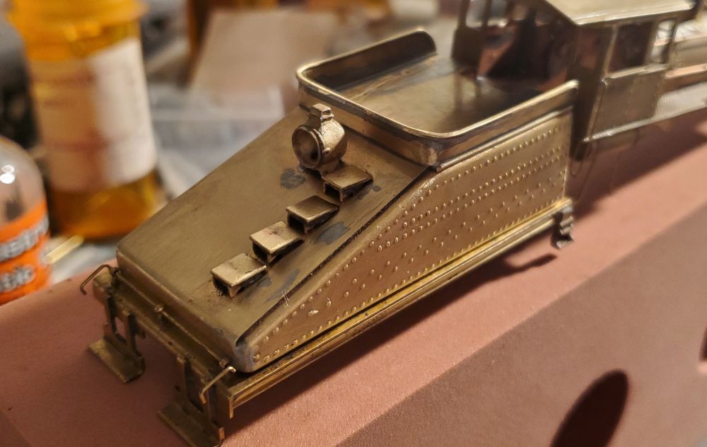 Tender got a light soldered on. The engine Im replicating, #313, didnt have slope steps but I didnt want to remove them. Still needed is a filler hatch on the top. 