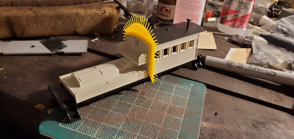 A Mantua clearance car stripped of lettering with trussrods replaced with monofilament. 