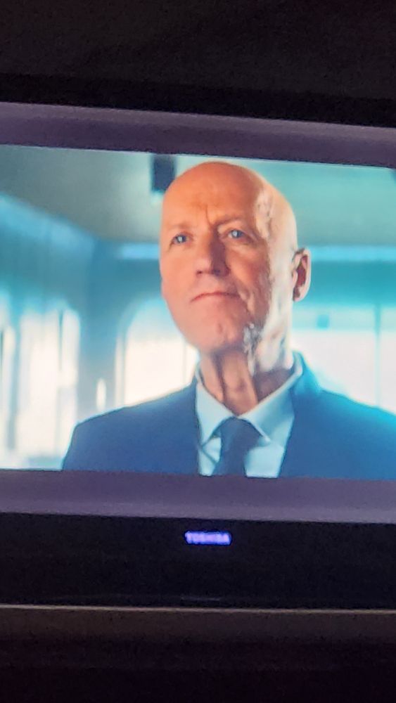Ade Edmundson as Atom Eins in Alien Earth 