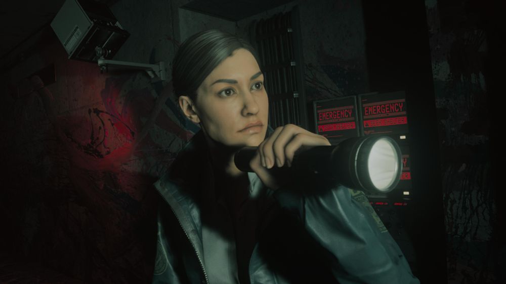 A screenshot of Agent Estevez from Alan Wake 2 holding a torch.