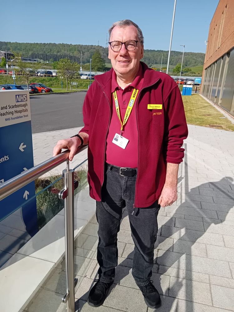 Volunteer outside Scarborough Hospital.