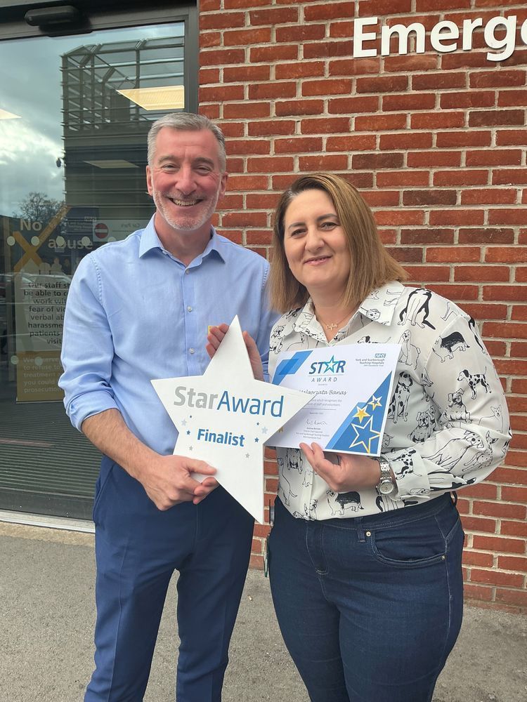 Margaret alongside Andrew Bertram outside the entrance to York Hospital's Emergency Department.
