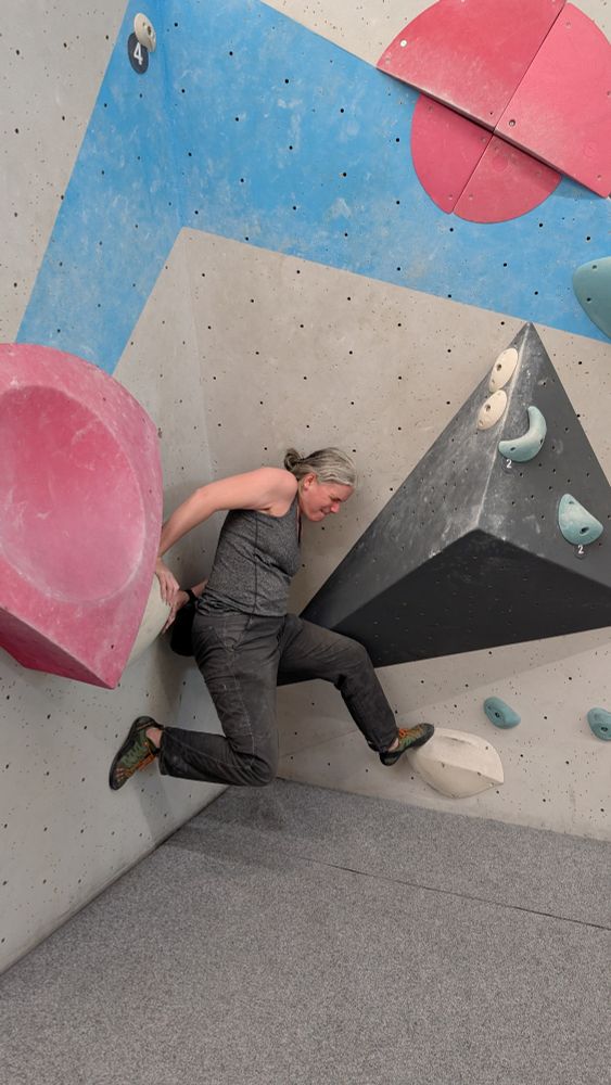 Me pressed into a corner, holding myself up with both hands behind me and my feet against both walls. My head is quite red and my face looks very grimly