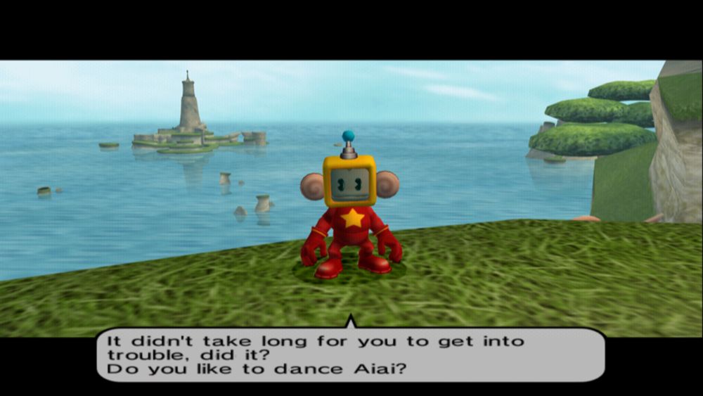 A screenshot from Super Monkey Ball Adventure (PlayStation 2). A monkey stands at the edge of a cliff facing the player, framed in the center of the screen, in front of an ocean vista with islands in the distance. He wears a yellow TV-like helmet, an all-red suit with a big yellow star, and matching red gloves and boots. He speaks the following dialogue:
"It didn't take long for you to get into trouble, did it?
Do you like to dance Aiai?"