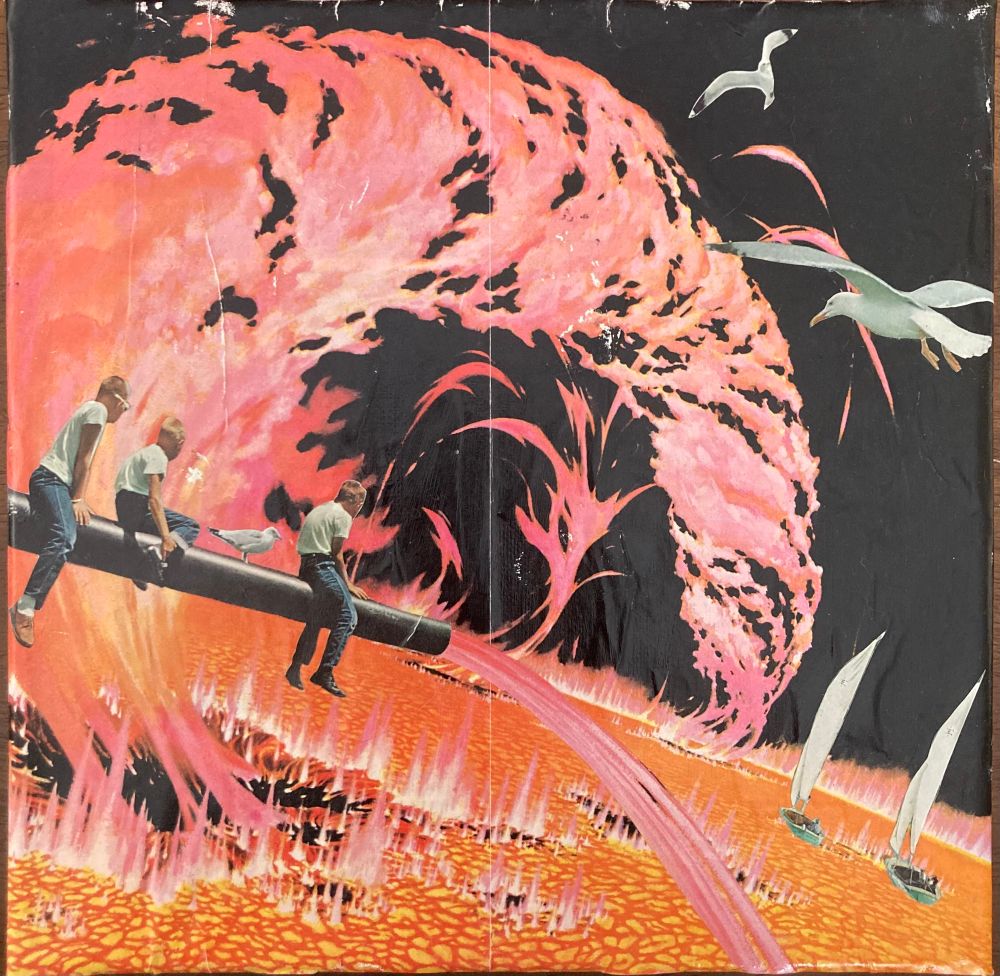 A photo of a paper collage.  The background is all orange and coral pink with liquid fire and lava flows.  Three white boys with blond, shaved heads in white tshirts and jeans are straddling a canon.  More lava is flowing from the cannon like a faucet.  Two sailboats are floating on the lava like water and two seagulls fly in the black sky. 