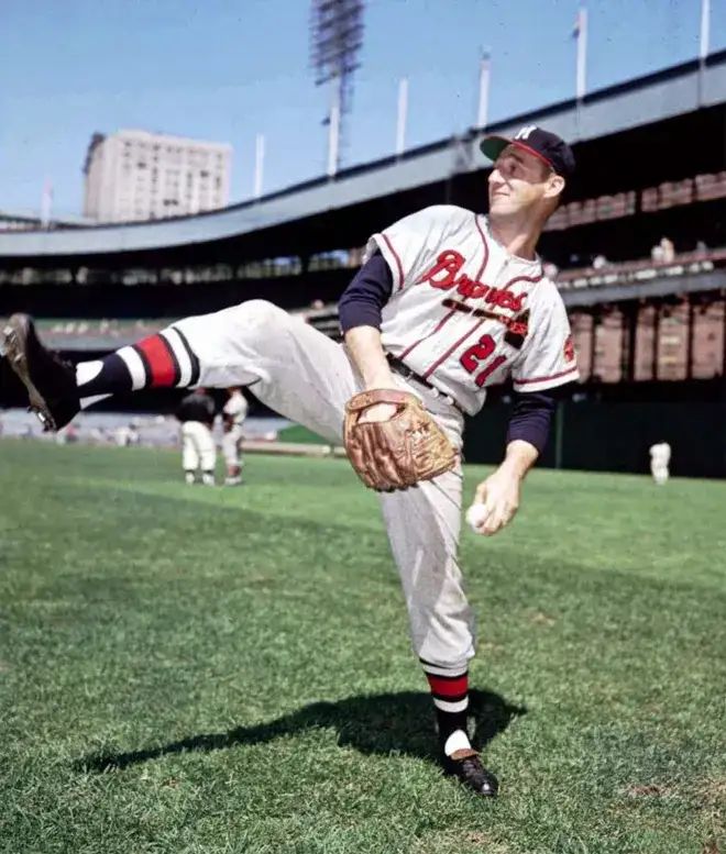photo of warren spahn in a milwaukee braves uniform demonstating his motion