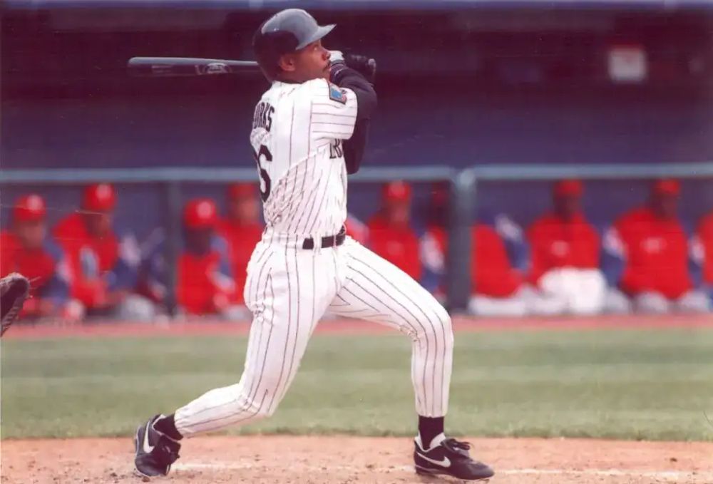 photo of ellis burks swinging a bat as a rockie