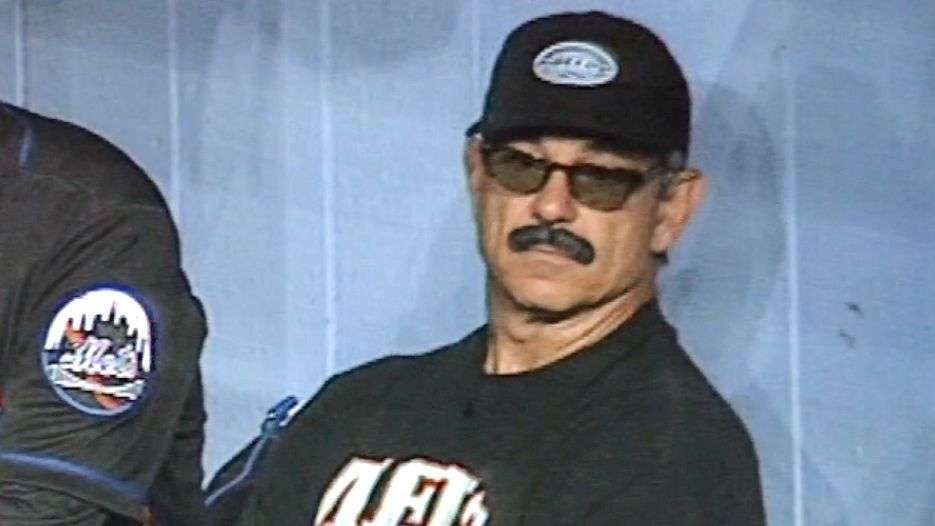 photo of someone who couldn't possibly be bobby valentine because he's been ejected already and definitely isn't sitting on the bench in disguise