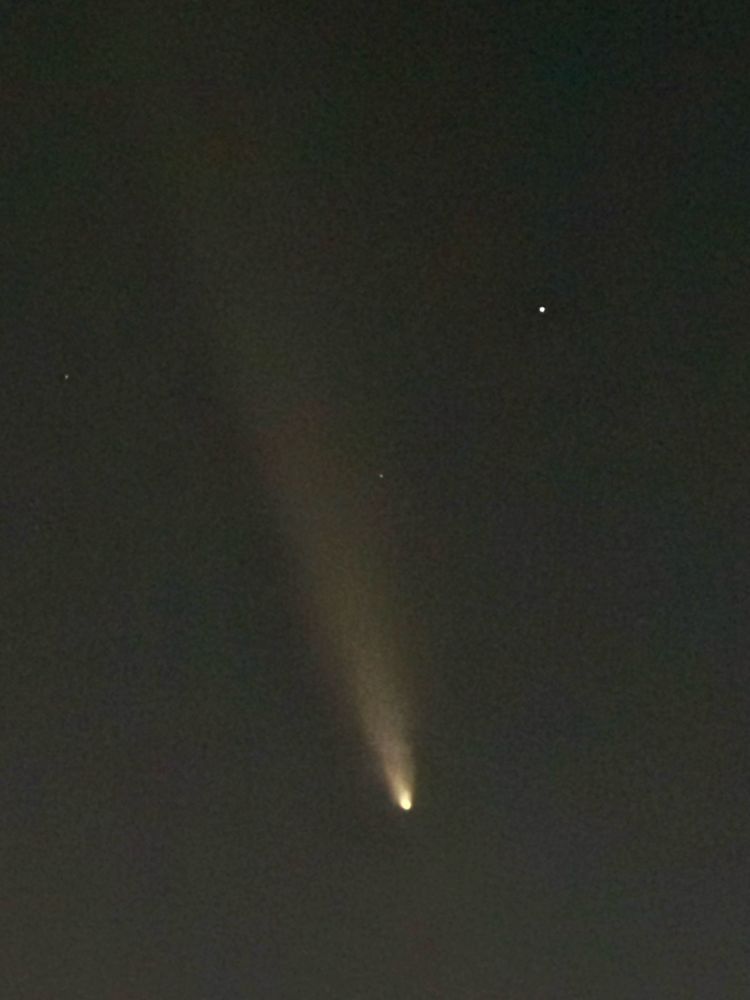 A picture of a comet with the tail across the entire frame