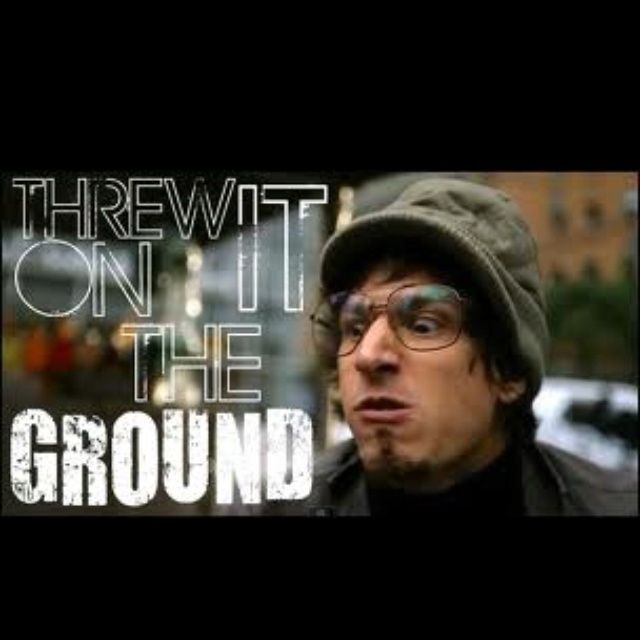 Lonely island’s song throw it on the ground. Text says throw it on the ground. A man makes an angry face. 