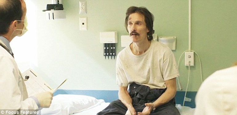 Matthew McConaughey from the film the Dallas Buyers club. He is sickly, sitting in a hospital exam bed as a doctor talks to him. 