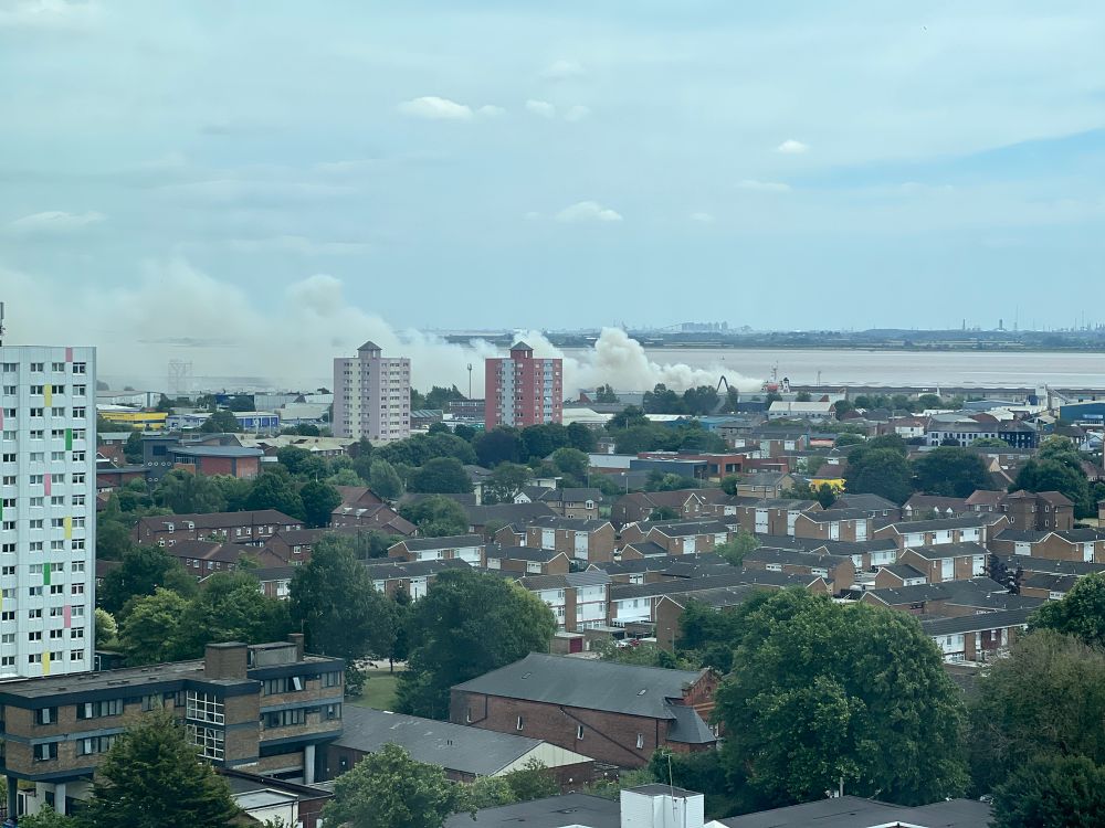 Smoke billows from a ship fire across Hull