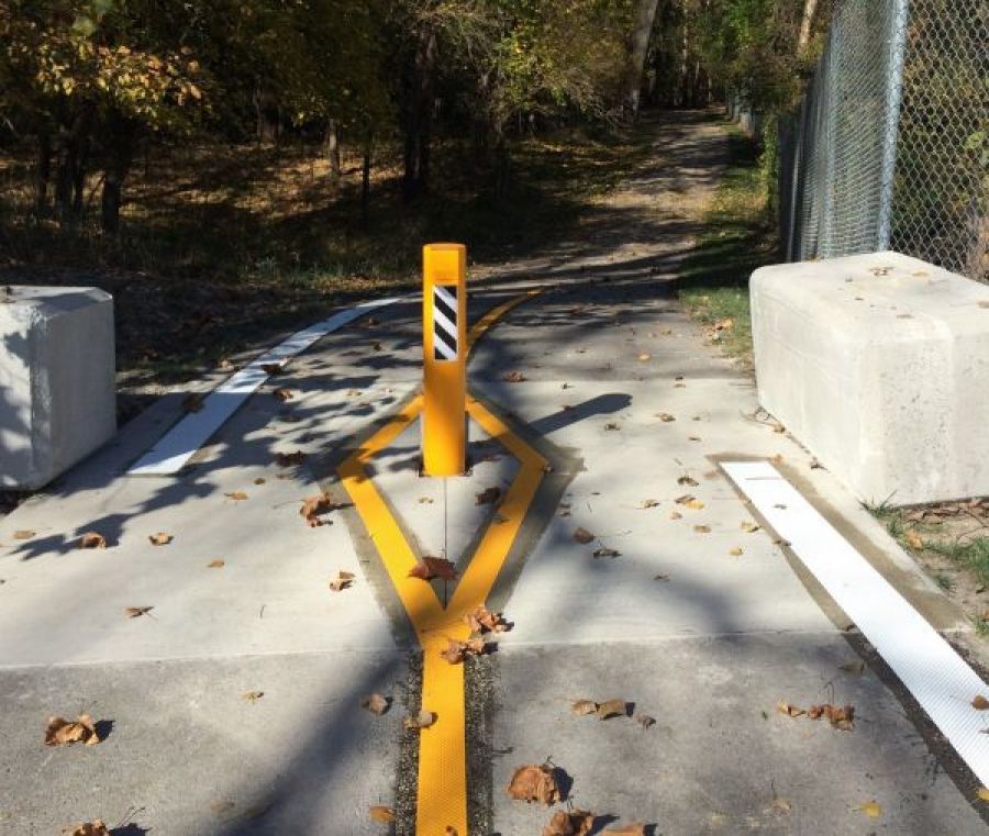 Example of Solid bollard blocking bi-directional bike/ped path