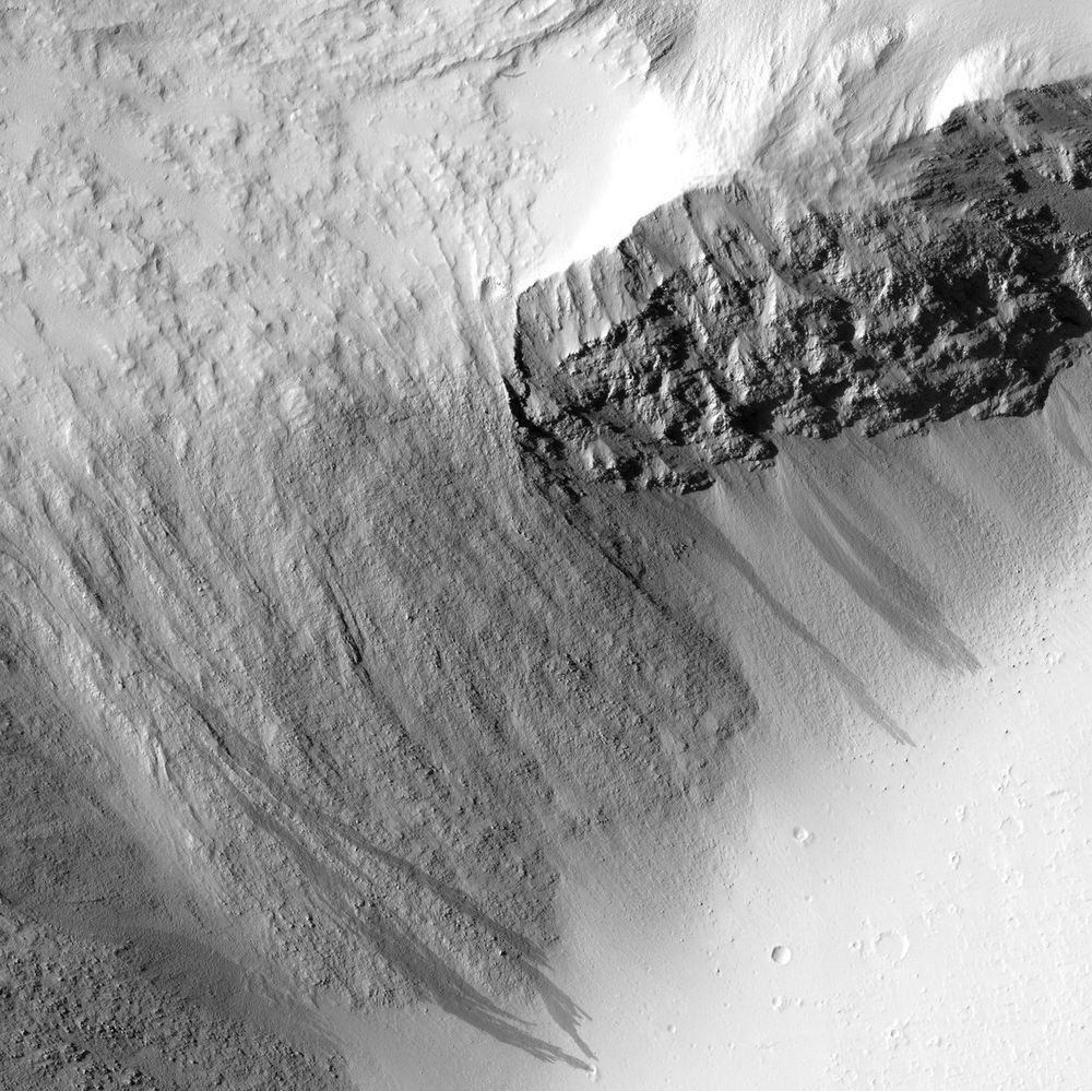 HiRISE image of solidified lava "waterfall" cascading down the basal cliff of Olympus Mons, Mars