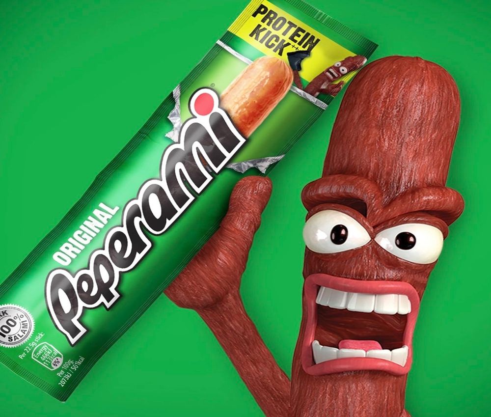 Peperami advent showing the thin stick of meat in its packaging. Held by the anthropomorphic version of the snack.