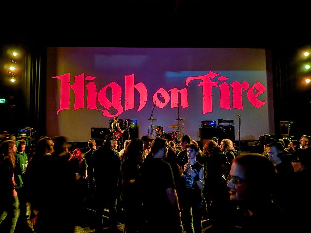 A crowd in a semi-lit theater waits for High on Fire