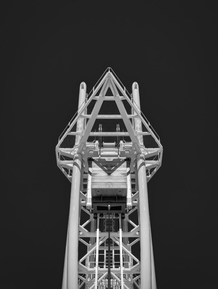 A black and white photo of a symmetrical structure used to lift a bridge.