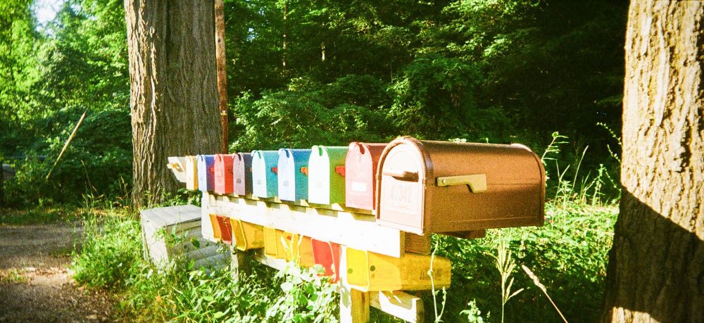 Panoramic photo of colorful mailboxes
