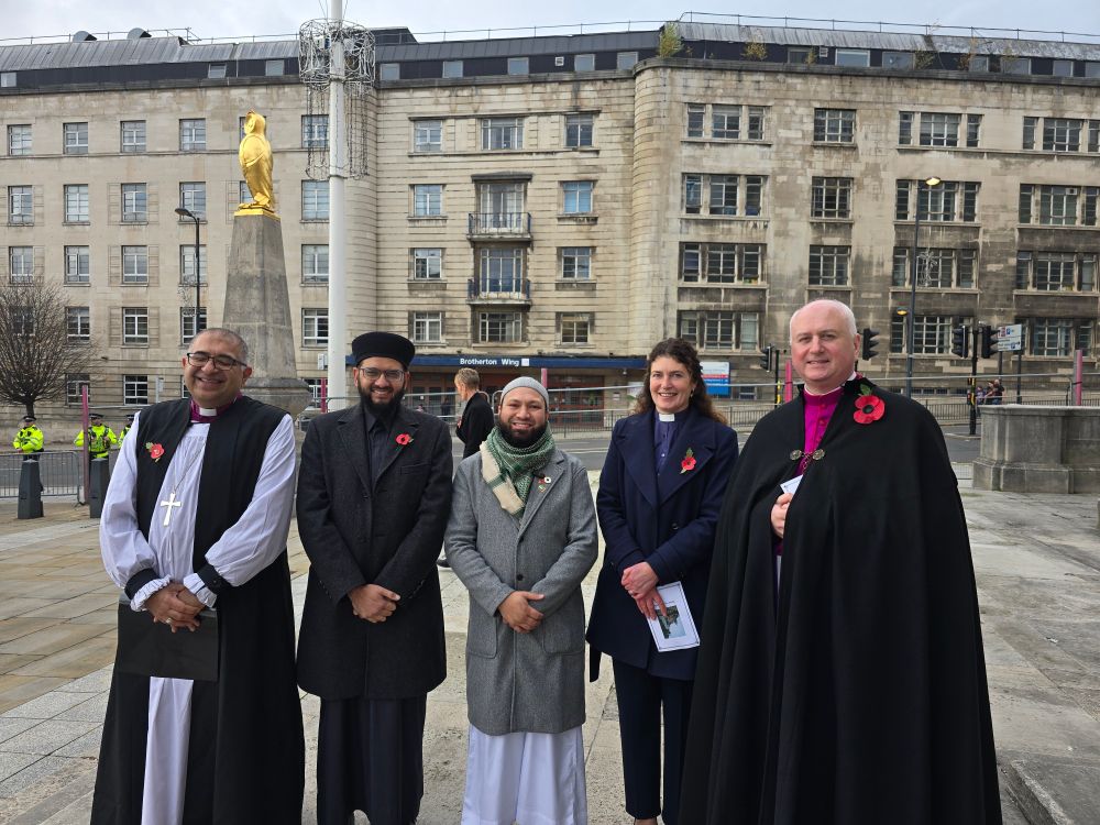 Councillor Mothin Ali stood with religious leaders from Leeds 