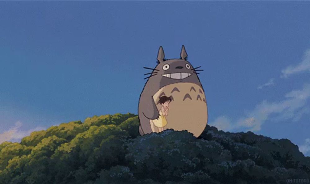 a cartoon drawing of a totoro and a bus with the words oh-toto on the bottom