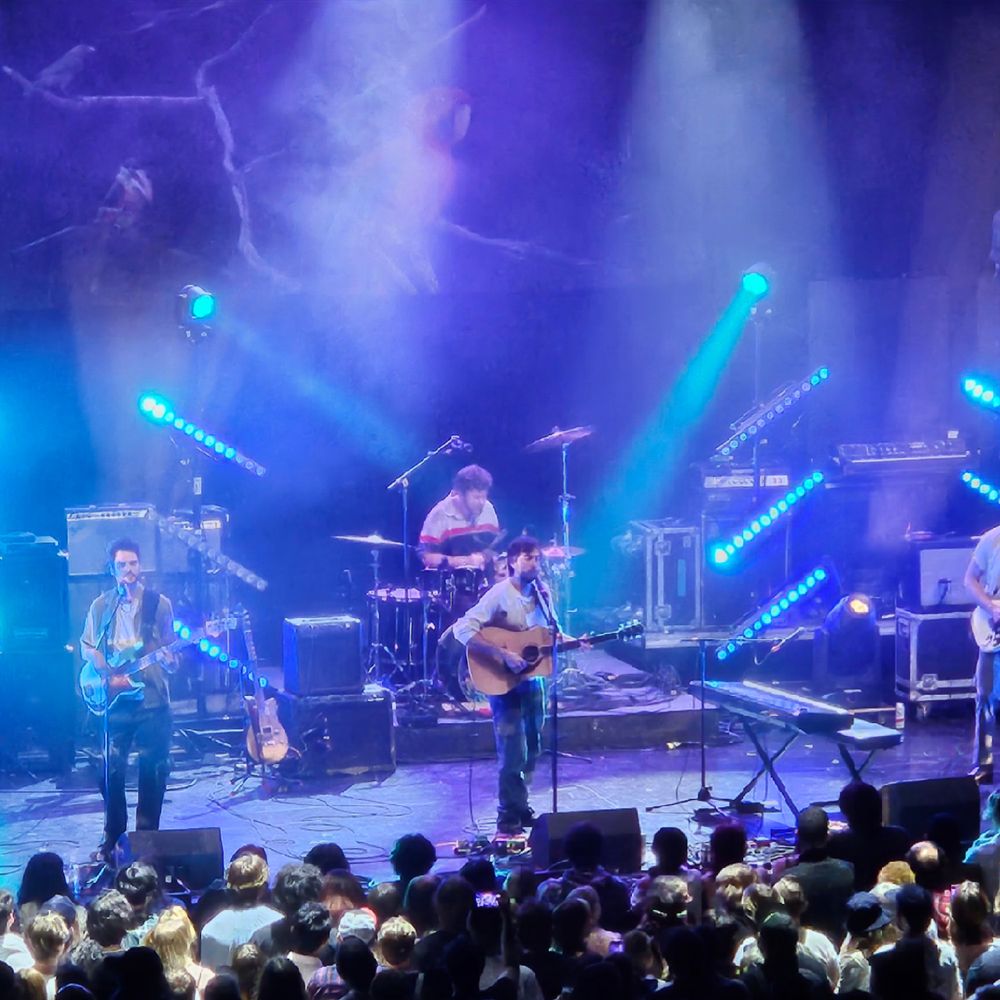 Alex G and band on stage at the Artpark Mainstage Theatre