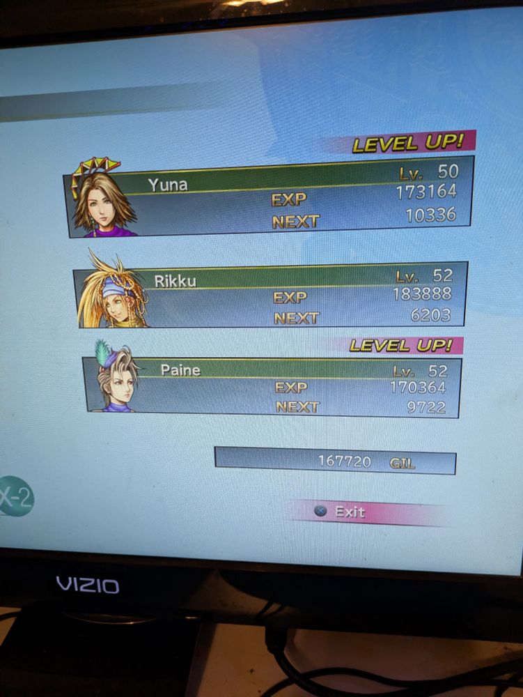 Results screen of a battle in Final Fantasy X-2. Yuna is level 50 and Rikku/Paine are both level 52