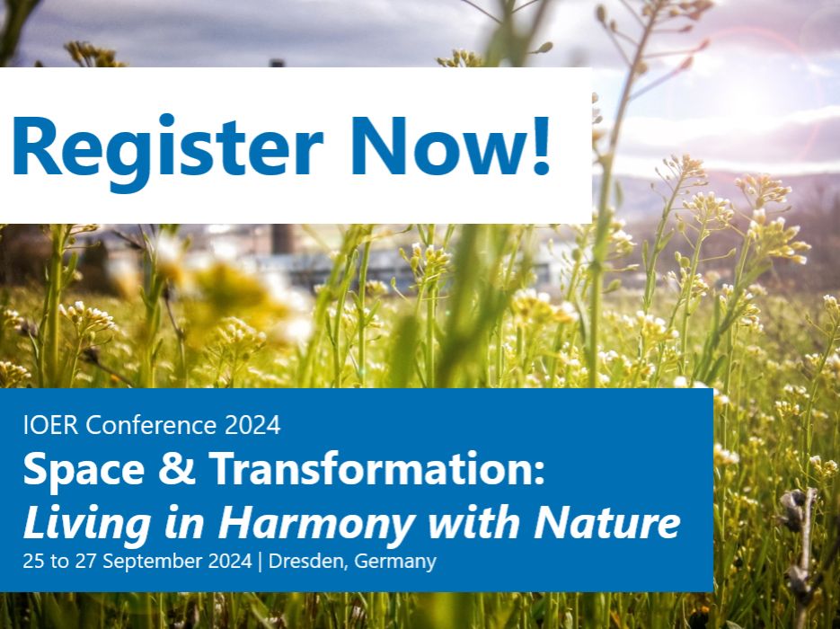 Symbolic image for the conference: A close-up of a flowering meadow. An industrial building in the background. In the foreground two banners: 1) "Register Now!", 2) IOER-Conference 2024 - "Space & Transformation: Living in Harmony with Nature" - 25 & 27 September 2024"