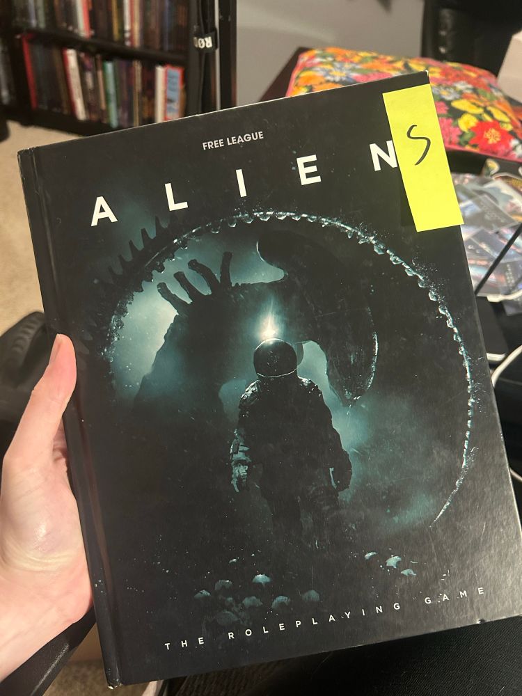 Image of ALIEN corebook with an ‘s’ on a sticker note so the core book now reads ‘Aliens’ 