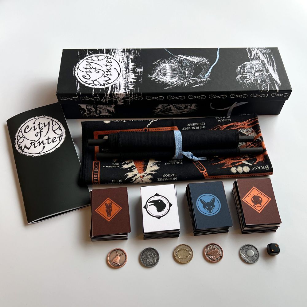 All the physical components of City of Winter box including coins, and scroll.