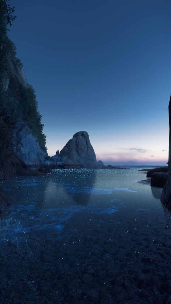 A screenshot from Ghost of Tsushima showing a cove on the ocean side. The water is lightly biolumiscent, and lit by the very early morning sun. 