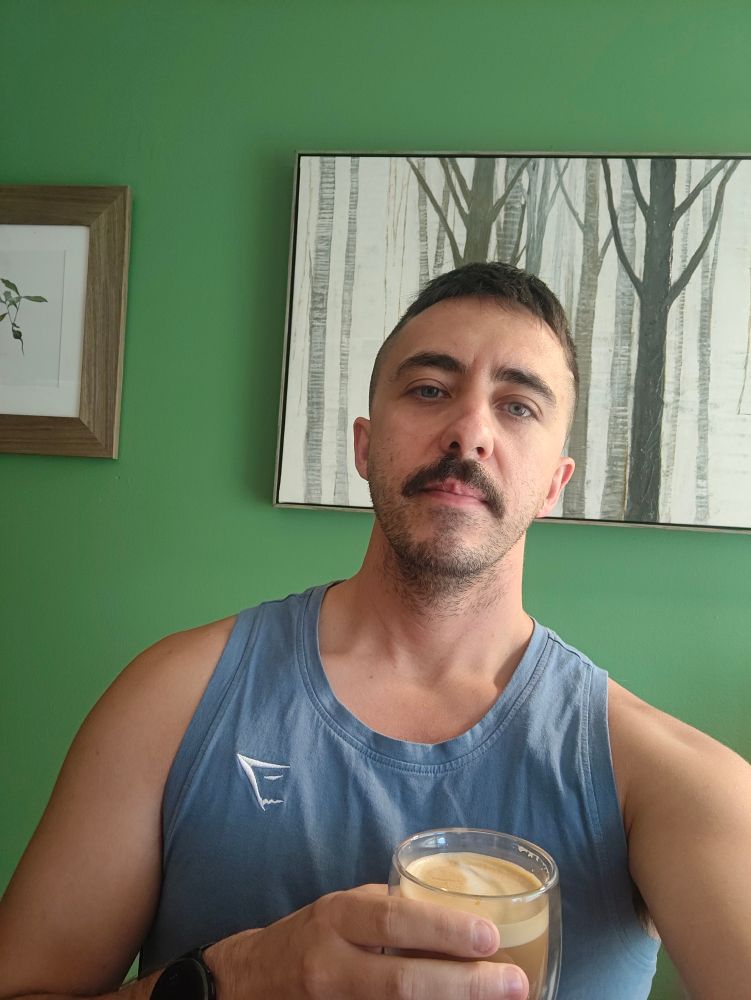 A tired Miles with latte in hand.