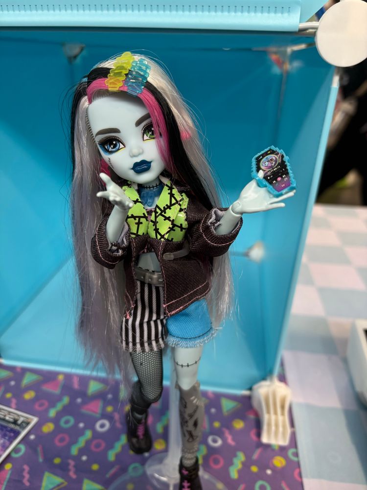 The same Frankie stein doll stands with their hand moved as if they just blew you a kiss