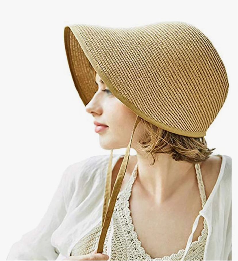 Advertising picture showing the side profile of a woman wearing a plain straw bonnet. The bonnet looks like it belongs in Regency Britain, only with no coloured ribbons or trim. I just read a review that says it’s fake straw.