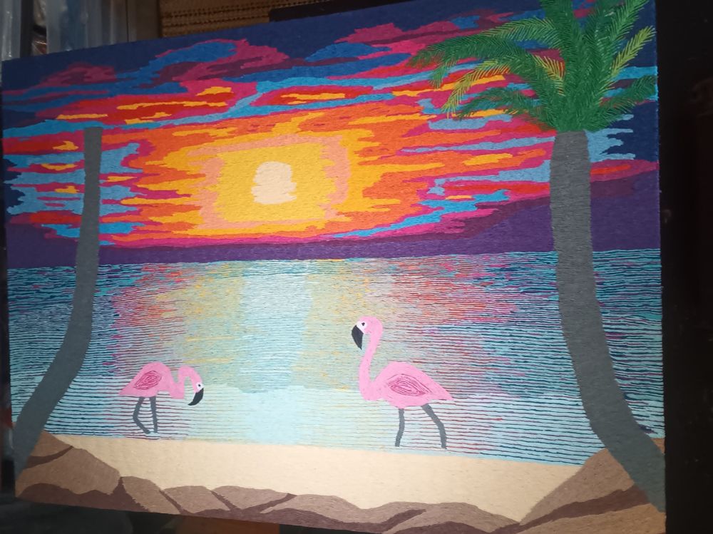 Updated WIP photo of a sunset made out of colorful tissue paper twists.
