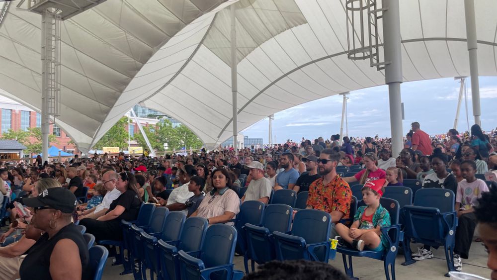 View of folks sitting in the seats at Pier Six Pavilion.