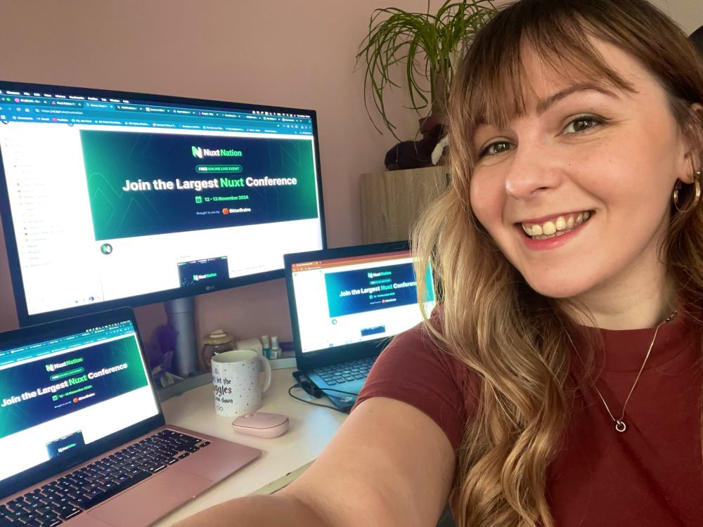 A selfie in front of 3 screens, waiting for an online conference to start.
