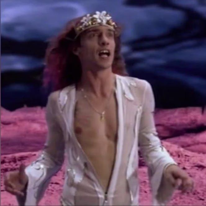 Justin Hawkins in open fronted chiffon rapture suit 