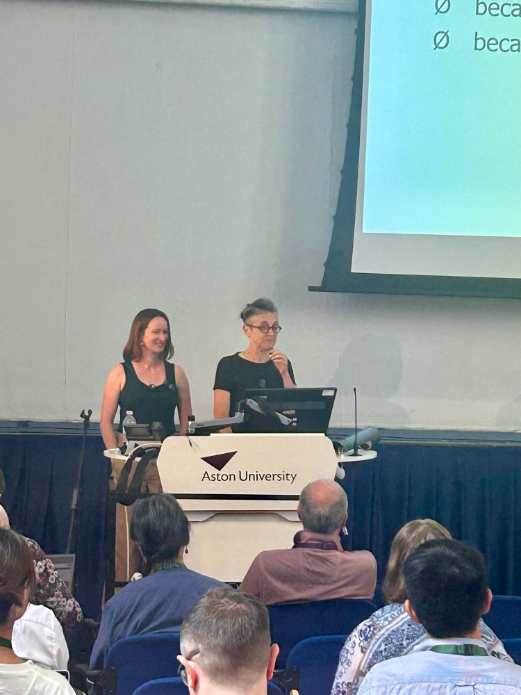 Charlotte Taylor and Anna Marchi giving a plenary talk.