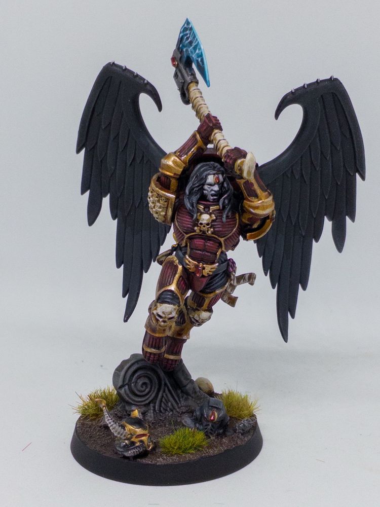 (Accessibility: photos of a painted Warhammer 40,000 miniature, Astorath from the Blood Angels Space Marines range in his box art colours of deep red, rich gold and black, photographed in a light box on a white background) 

Just painted him for a mate, cool mini. Really daunting at first but when I was getting the base coats down I realised he’s basically 3 colours with a couple of accent colours. 

Happy with the result! He might get his revenge on my Howling Banshees next time we can play 😉 
