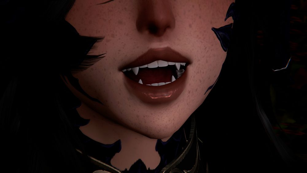 Close up of Khetya's mouth. She is holding her mouth open, displaying her sharp fangs!