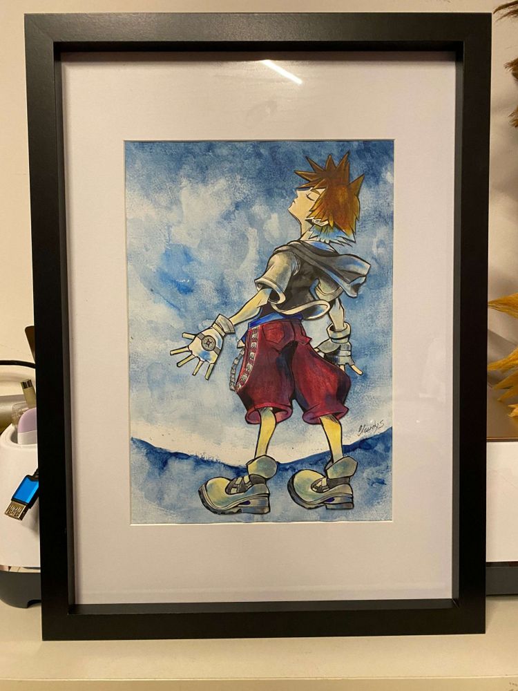 My watercolor drawing for the background and Sora cut out with alcohol markers, glued onto the watercolor sheet, which is now framed.