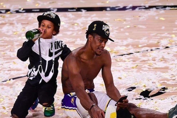 Rajon Rondo as a Lakers winning the championship in 2020 in the bubble with his son sipping champagne or cider.
